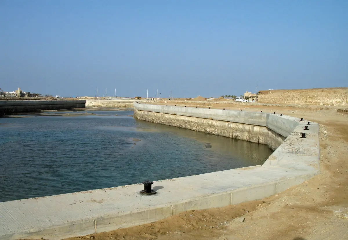 A canal with a stone quay in the marina district