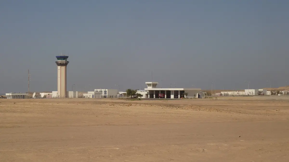 Airport control tower and low terminal in the desert