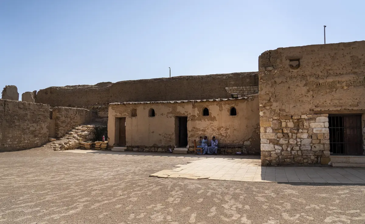 Mud brick buildings inside an old fort courtyard