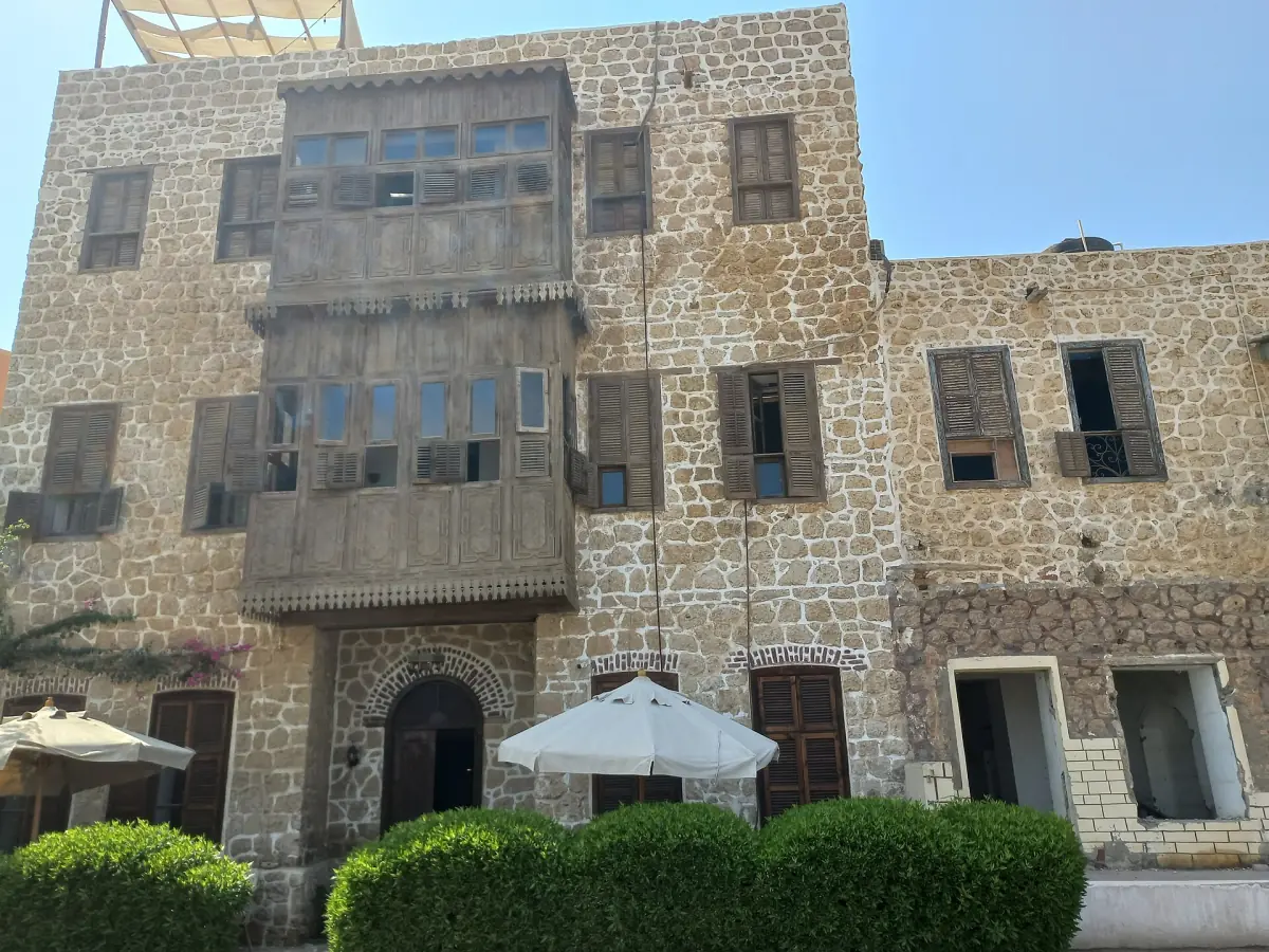 Old coral stone houses with wooden balconies